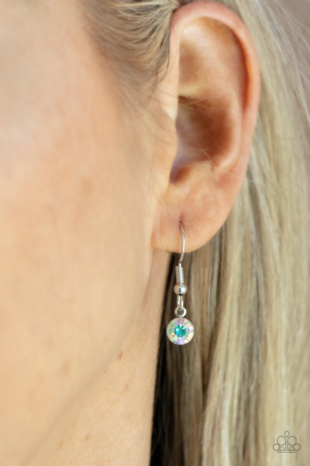 Paparazzi Accessories Instant Icon - Multi An oversized iridescent gem is pressed into the center of a sleek silver fitting, creating a mesmerizing statement piece at the bottom of a sleek silver chain. Features an adjustable clasp closure. Sold as one in