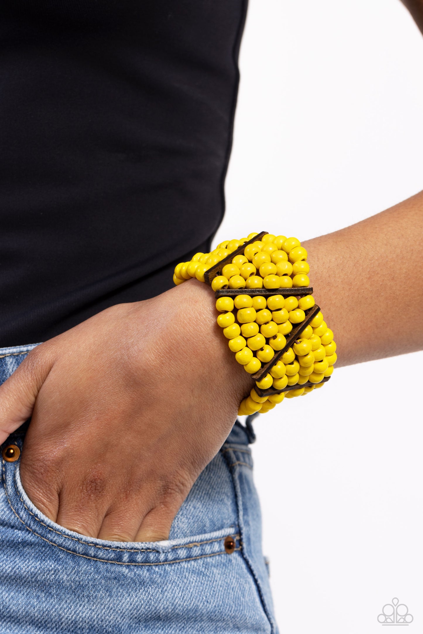Paparazzi Accessories Way Off TROPIC - Yellow Stacked layers of vibrant yellow round wooden beads are threaded along stretchy bands making a bold statement. Slender wooden bars are woven in on an angle and lean in opposite directions as they work their wa