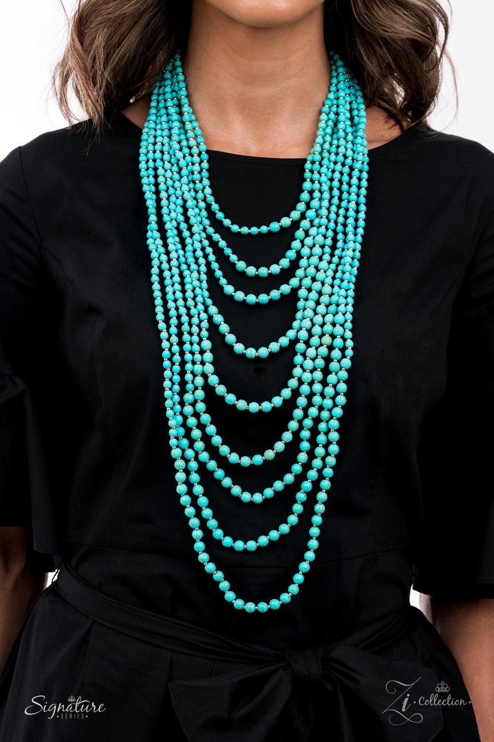 Paparazzi Accessories The Hilary Intermixed with dainty silver beads, a groundbreaking display of refreshing turquoise stone beads gradually increases in size as they drape into artisan inspired layers down the chest. The trailblazing length combined with