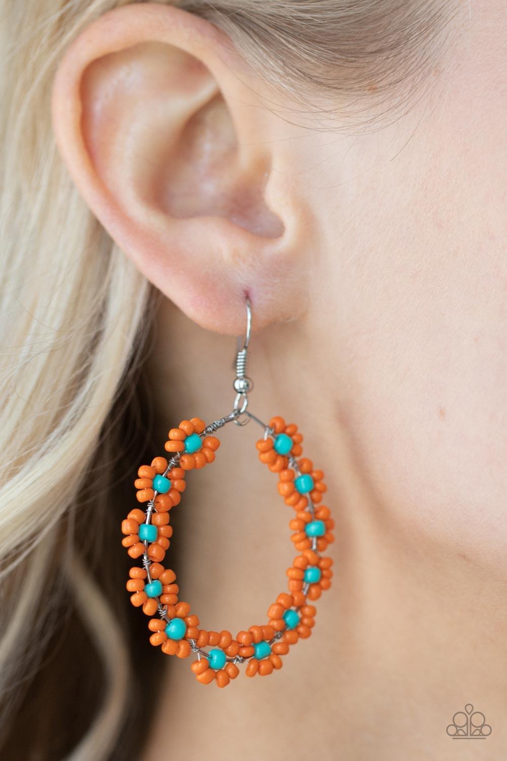 Paparazzi Accessories Festively Flower Child - Orange Dotted with turquoise beaded centers, a dainty collection of orange seed beaded floral frames are threaded along a wire hoop for a fabulous floral fashion. Earring attaches to a standard fishhook fitti