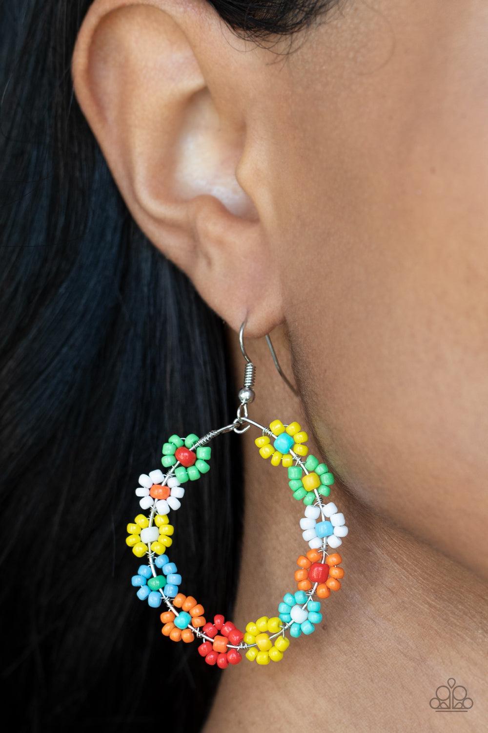 Paparazzi Accessories Festively Flower Child - Multi Dotted with mismatched multicolored beaded centers, a dainty collection of multicolored seed beaded floral frames are threaded along a wire hoop for a fabulous floral fashion. Earring attaches to a stan