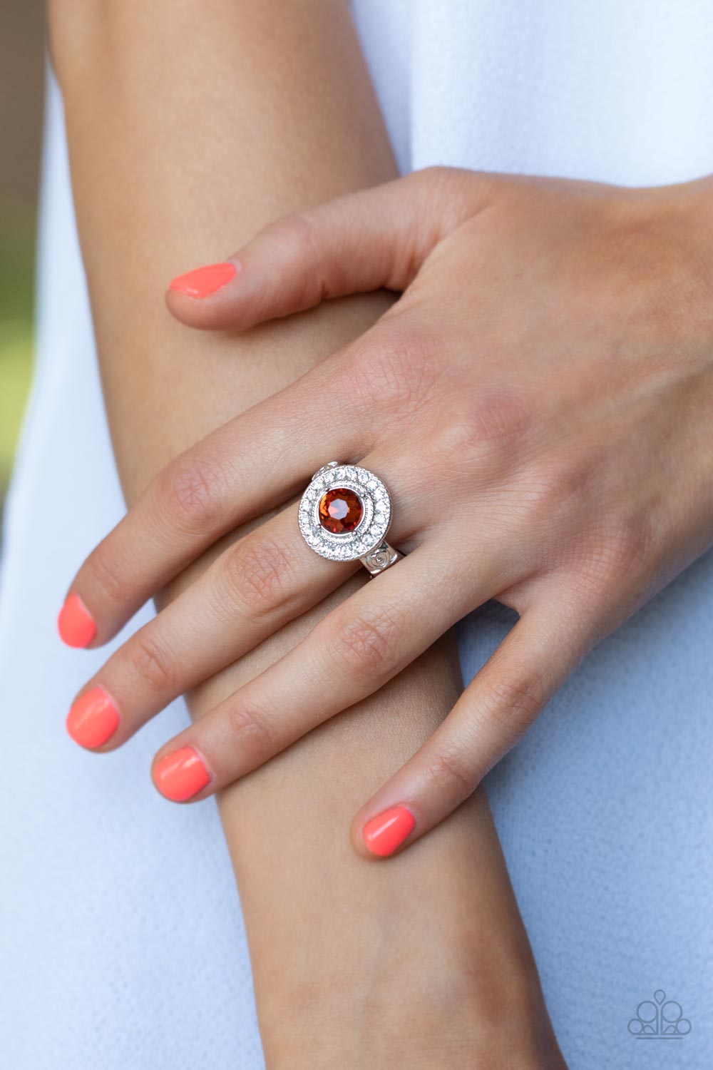 Paparazzi Accessories Targeted Timelessness - Brown Featuring a pronged silver fitting, an oversized topaz gem sits atop a radiant ring of glassy white rhinestones for a timeless fashion. Features a dainty stretchy band for a flexible fit. Sold as one ind
