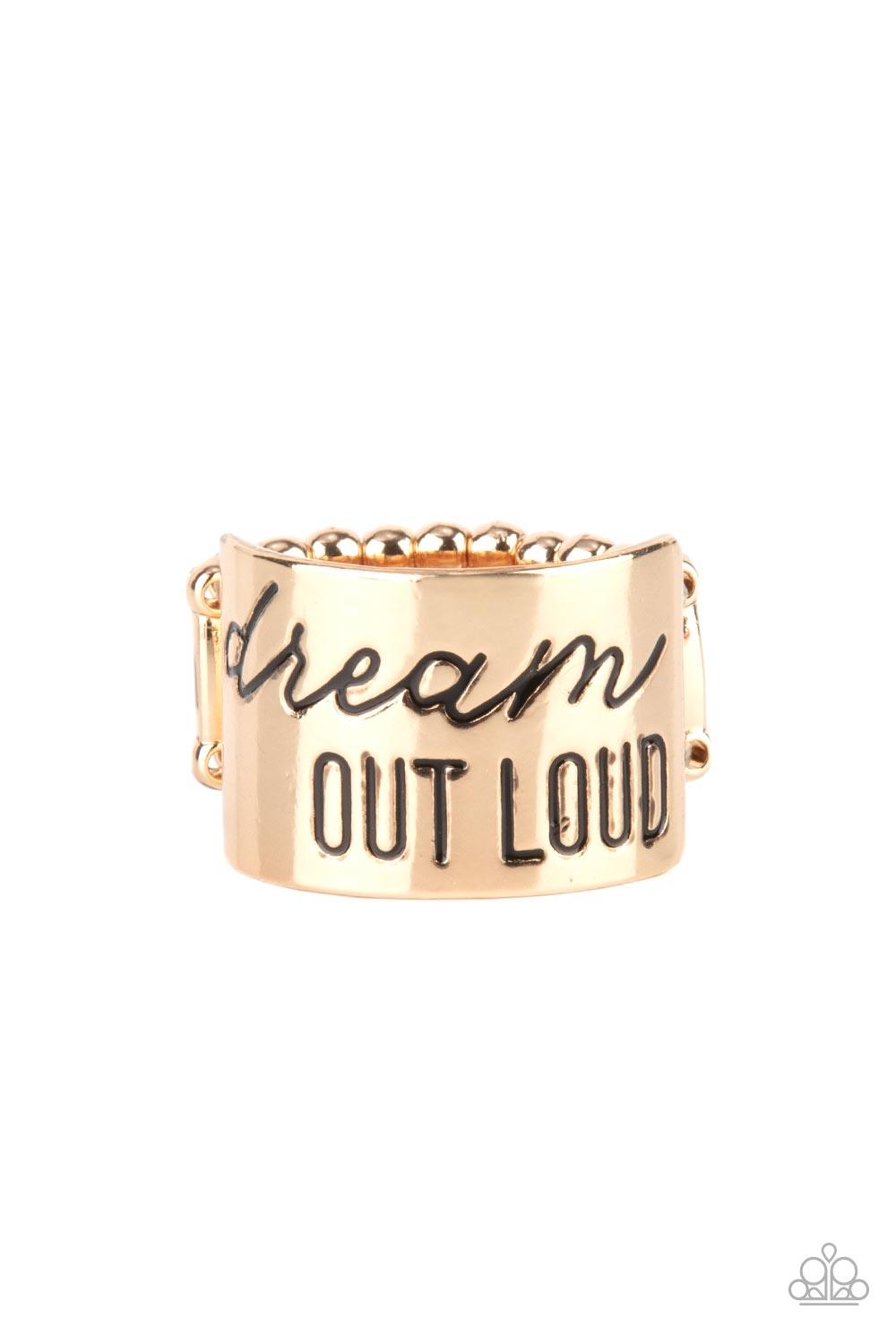 Paparazzi Accessories Dream Louder - Gold The front of a thick gold band is stamped in the phrase, "Dream out loud," creating an inspirational centerpiece across the finger. Features a stretchy band for a flexible fit. Sold as one individual ring. Jewelry