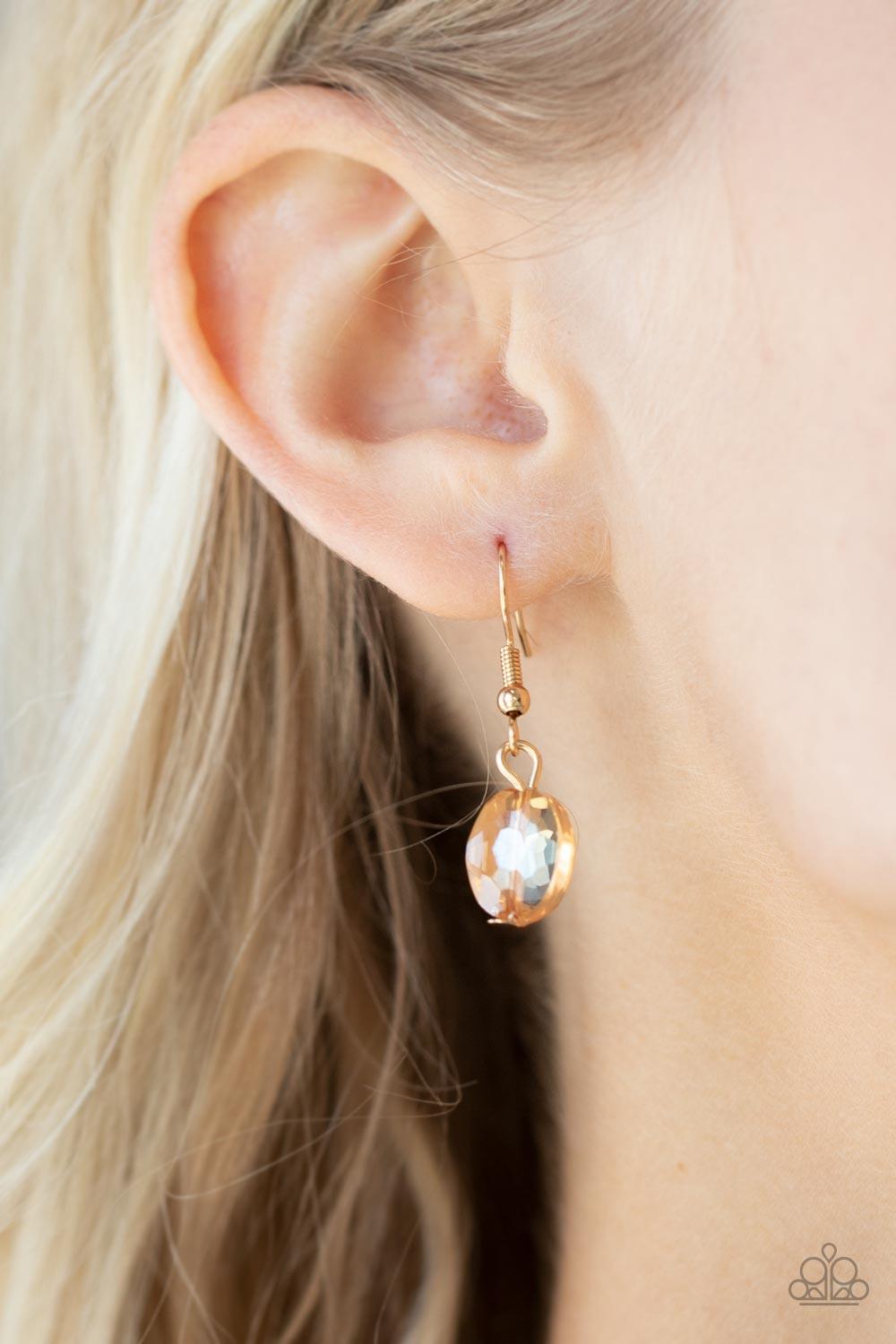 Paparazzi Accessories Cosmic Closeup - Gold Brushed in an iridescent finish, a faceted collection of oversized golden gems delicately links below the collar for a gritty glamorous look. Features an adjustable clasp closure. Sold as one individual necklace