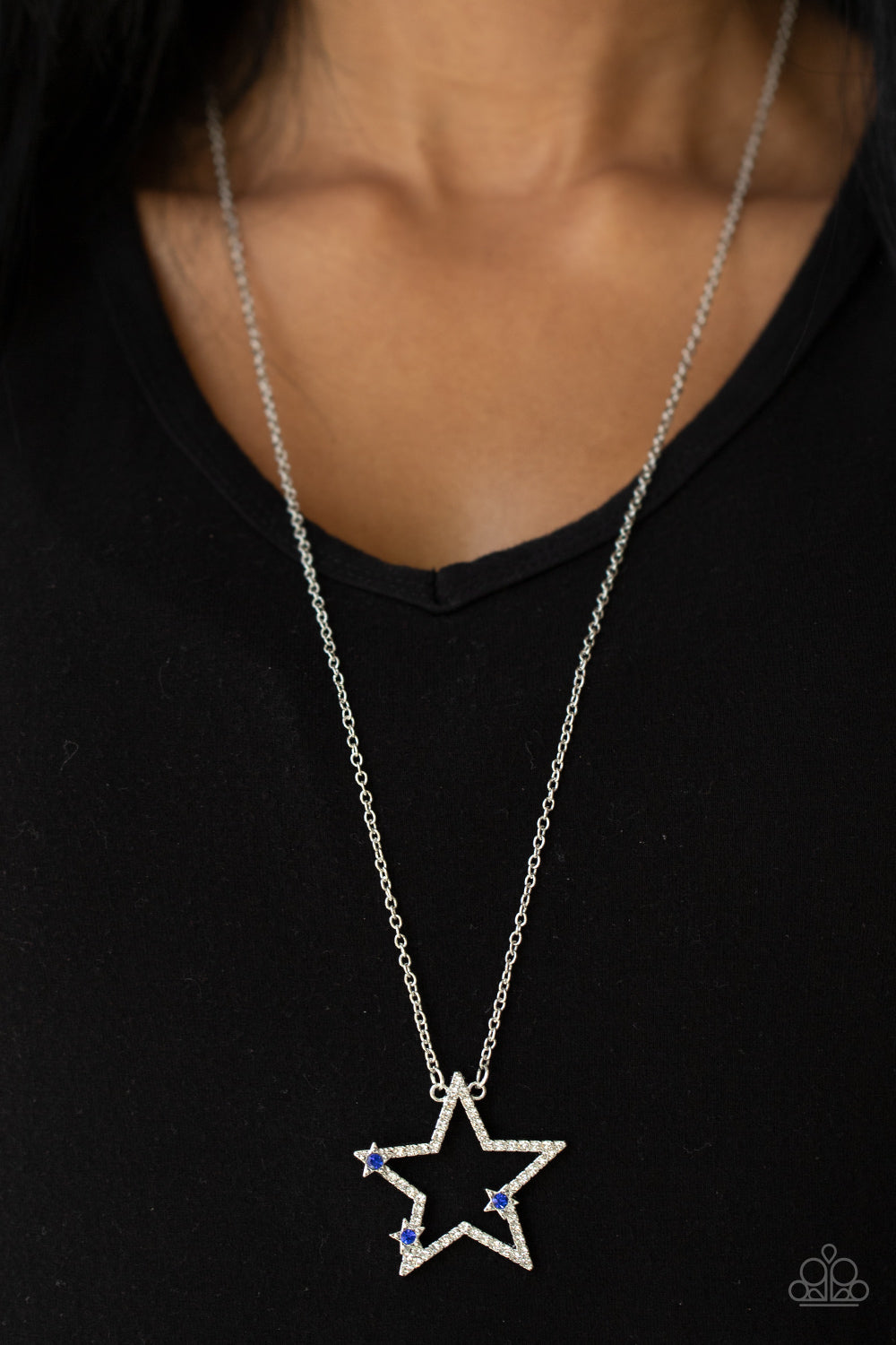 Paparazzi Accessories I Pledge Allegiance to the Sparkle - Blue Dotted with glassy blue rhinestone centers, a dainty trio of silver stars haphazardly dots the front of a white rhinestone encrusted silver star pendant for a stellar patriotic look. Features