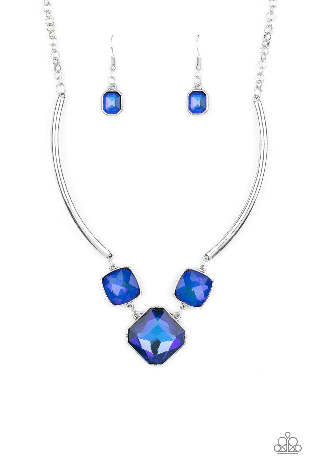 Paparazzi Accessories Divine IRIDESCENCE - Blue Featuring a subtle UV shimmer, an oversized collection of radiant cut blue gems delicately link at the bottom of two curved silver rods. Attached to shiny silver chains, the glamorously glitzy display sparkl