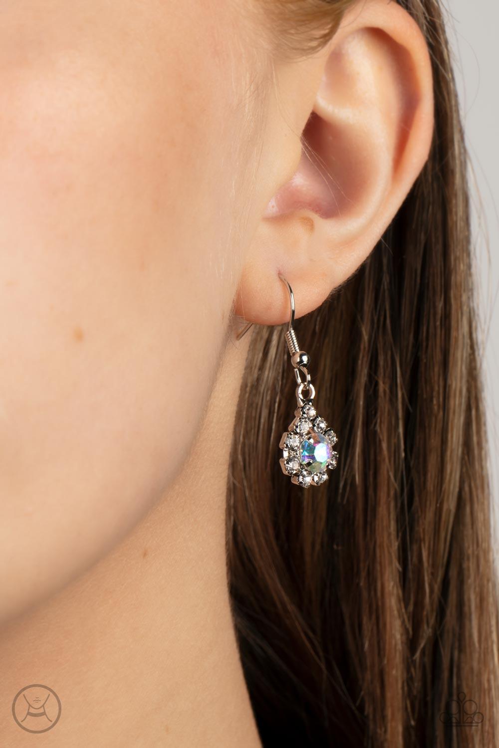 Paparazzi Accessories Princess Prominence - Multi A dainty strand of glittery white rhinestones encircle solitaire iridescent rhinestones around the neck, creating a glitzy fringe. Features an adjustable clasp closure. Sold as one individual choker neckla