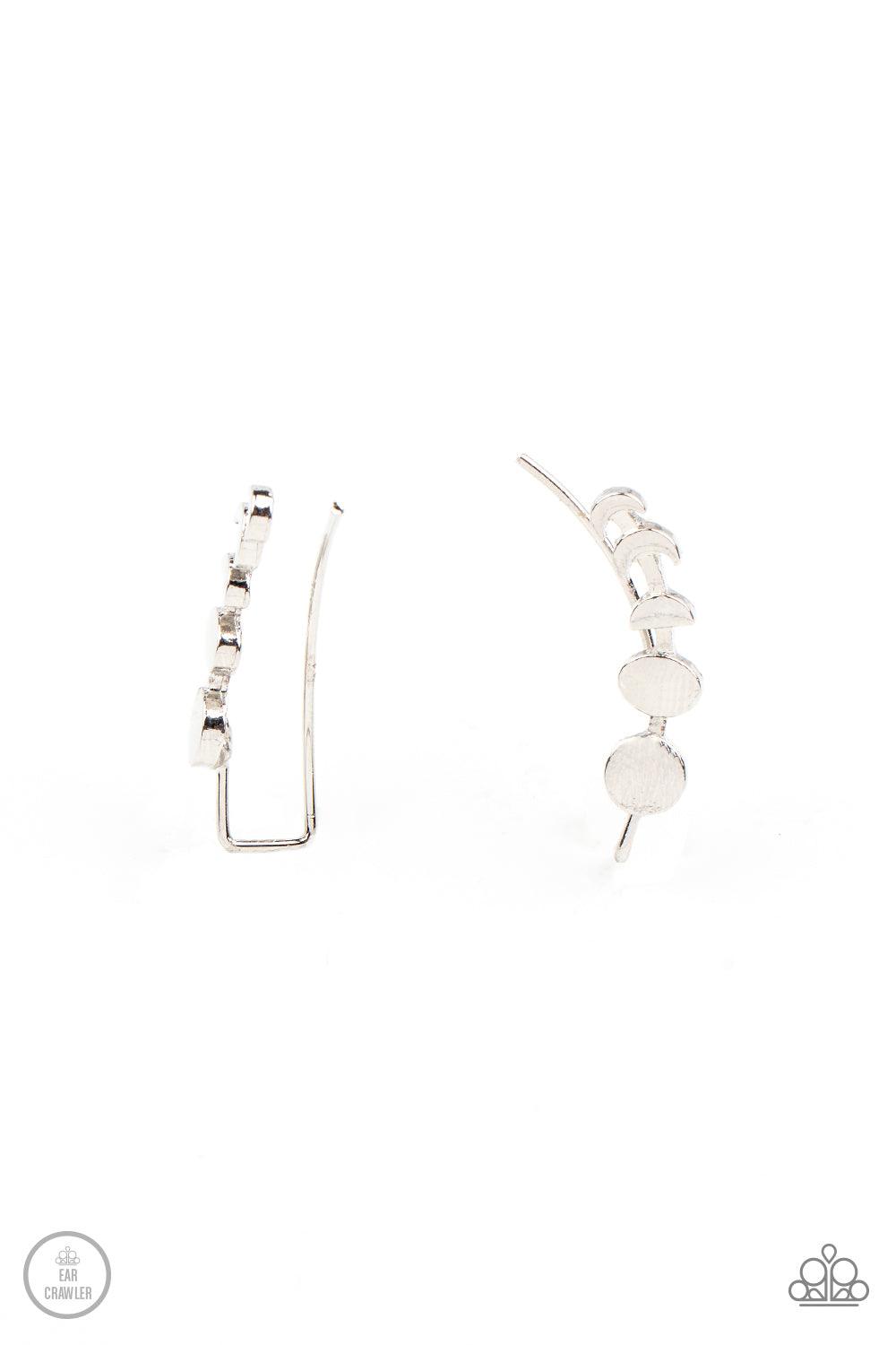 Paparazzi Accessories Its Just a Phase - Silver A dainty silver bar displays the phases of the moon as it curls across the ear for a stellar look. Features an extended post fitting that climbs the back of the ear and can be pressed together for a more sec