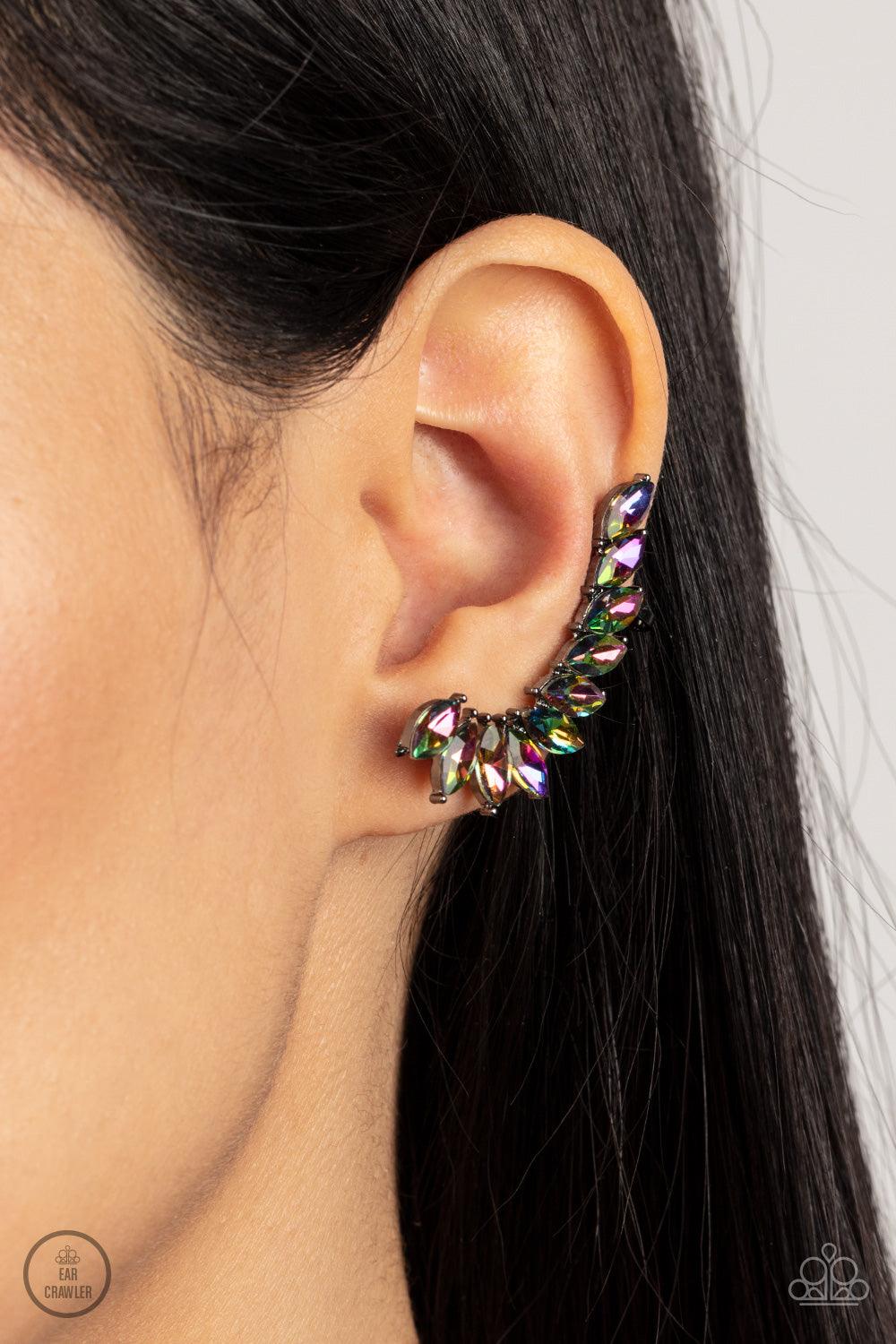 Paparazzi Accessories Stargazer Glamour - Multi A stellar stack of marquise oil spill rhinestones curve up the ear, creating a smoldering sparkle. Features a clip-on fitting at the top for a secure fit. Sold as one pair of ear crawlers. Jewelry