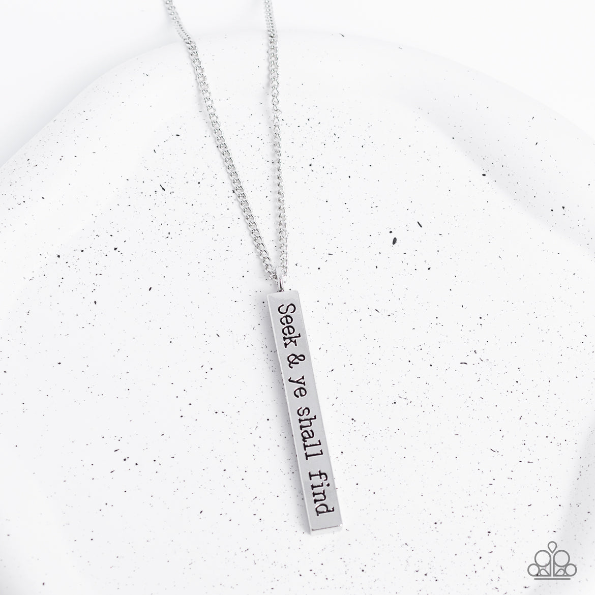 Paparazzi Accessories Matt 7:7 - Silver A flattened rectangular pendant is stamped in the biblical phrase, "Seek & ye shall find. Matt7:7," creating an inspirational sight at the bottom of an extended silver chain. Features an adjustable clasp closure. So