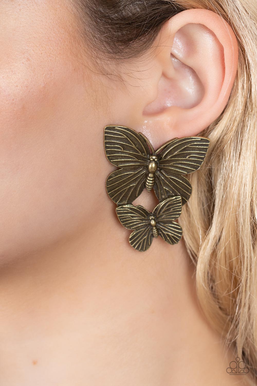 Paparazzi Accessories Blushing Butterflies - Brass Veined with lifelike textures, a pair of rustic brass butterflies flutters from the ear for a whimsical fashion. Earring attaches to a standard post fitting. Sold as one pair of post earrings. Jewelry