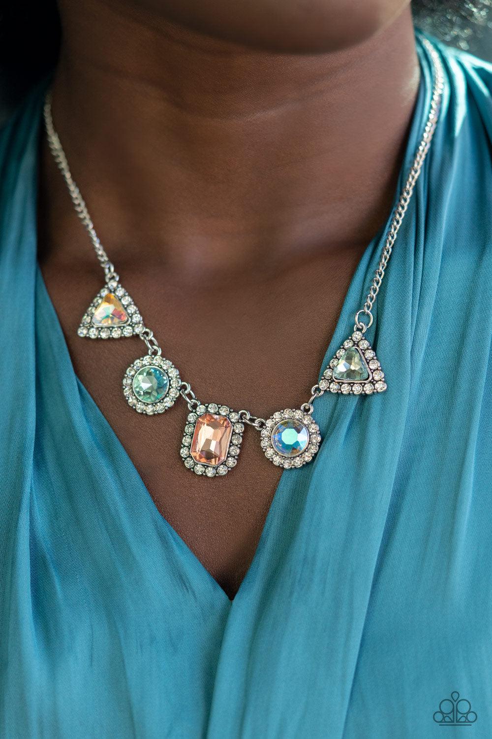 Paparazzi Accessories Posh Party Avenue - Multi Featuring triangular, round, and emerald style cuts, an iridescent collection of multicolored rhinestones are bordered in glassy white rhinestones as they delicately link below the collar for a sparkly state