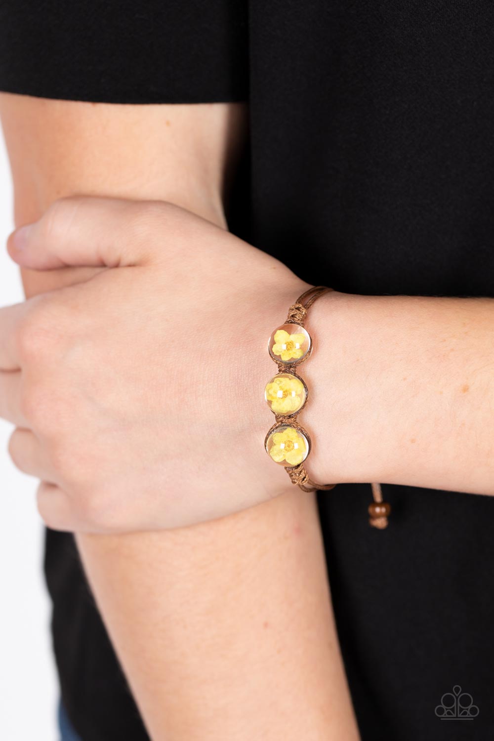 Paparazzi Accessories Prairie Persuasion - Orange Dainty orange blossoms are encased inside of glassy beads that are knotted in place with brown cording around the wrist, resulting in a naturally beautiful centerpiece. Features an adjustable sliding knot