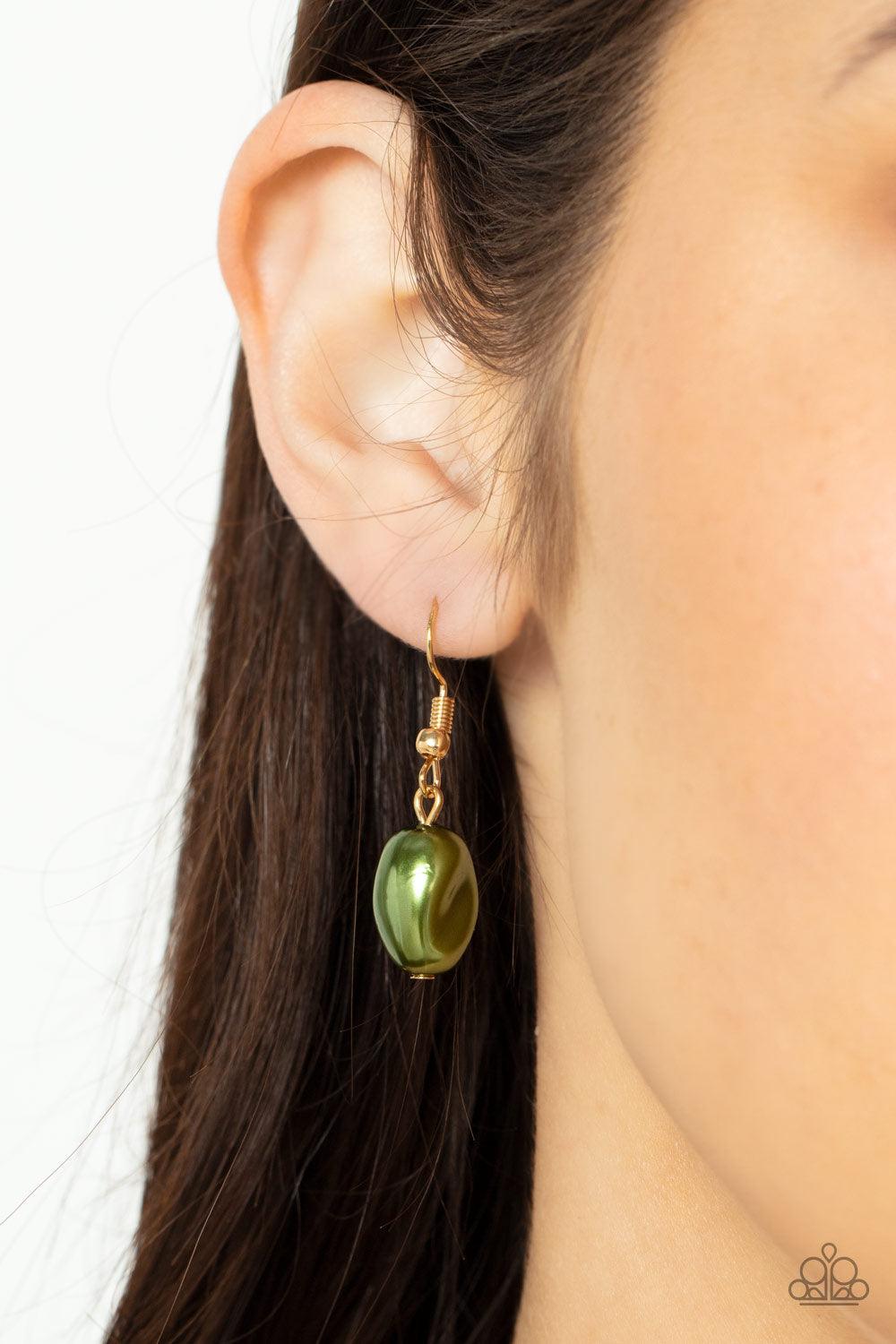 Paparazzi Accessories Pardon My FABULOUS - Green Infused with dainty gold beads, an elegant collection of imperfect green pearls and gold beads asymmetrically adorn a substantial gold chain across the chest for an effortless elegance. Features an adjustab