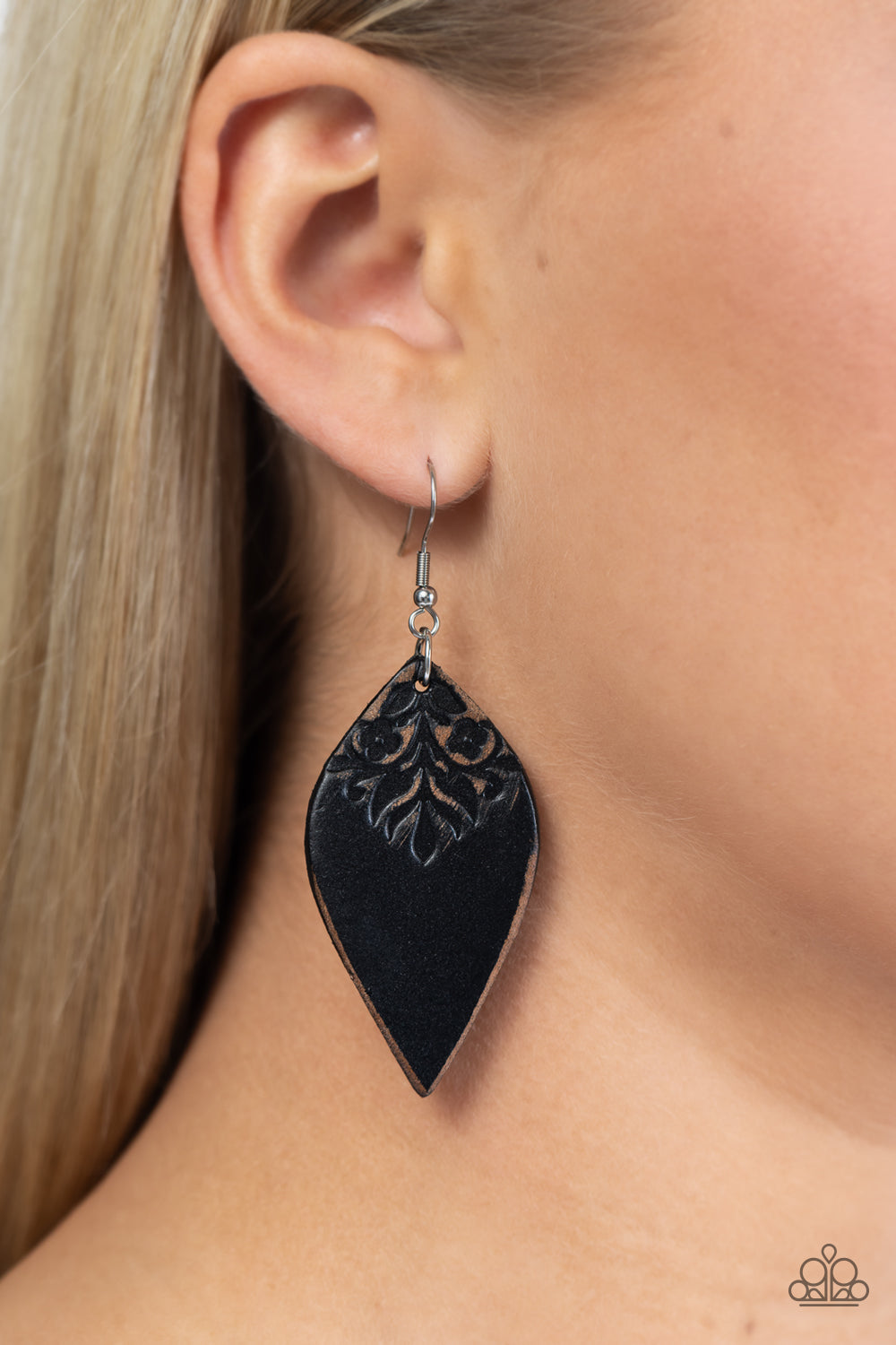 Paparazzi Accessories Naturally Nostalgic - Black The top of a petal shaped black leather frame is stamped in a distressed floral pattern, resulting in a rustic display. Earring attaches to a standard fishhook fitting. Sold as one pair of earrings. Jewelr
