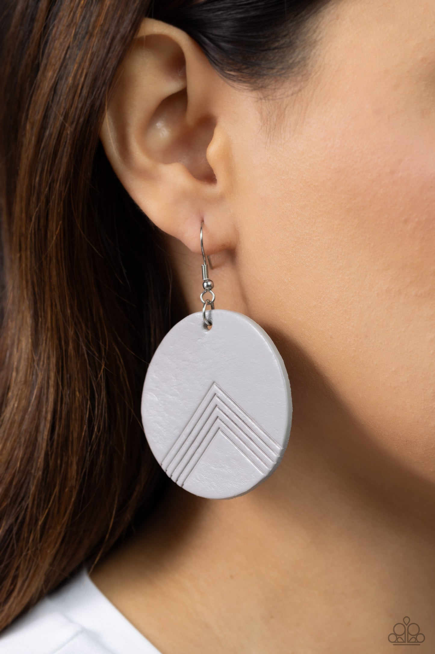 Paparazzi Accessories On the Edge of Edgy - Silver An Ultimate Gray leather disc is etched in an angular geometric accent, creating a modern look. Earring attaches to a standard fishhook fitting. Sold as one pair of earrings. Jewelry