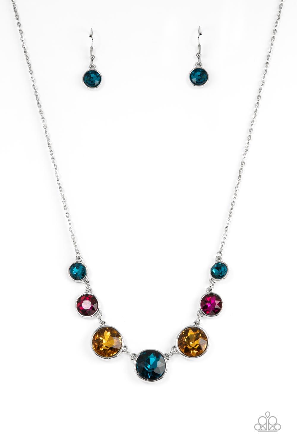 Paparazzi Accessories Pampered Powerhouse - Multi Encased in shiny silver frames, a glitzy collection of blue, yellow, and pink rhinestones gradually increase in size as they link below the collar for a flawless finish. Features an adjustable clasp closur