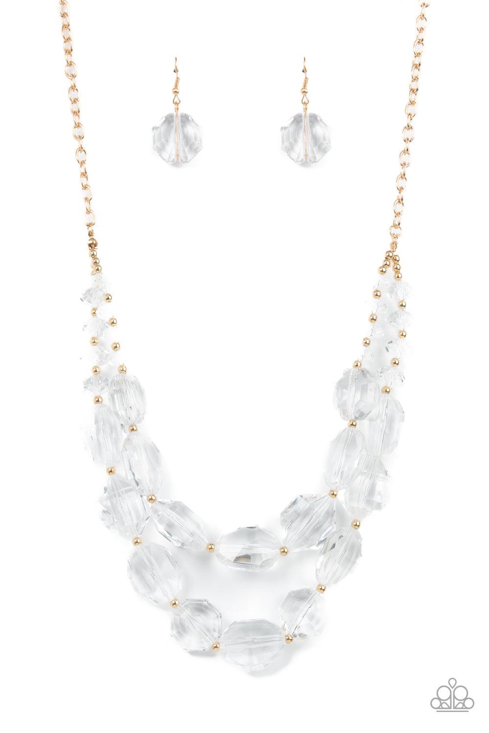 Paparazzi Accessories Icy Illumination - Gold Separated by dainty gold beads, an icy collection of oversized and faceted white gems are threaded along invisible wires below the collar, resulting in prismatic layers. Features an adjustable clasp closure. S