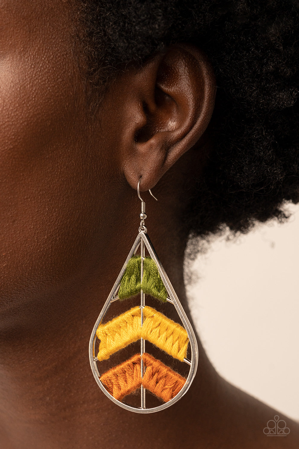 Paparazzi Accessories Nice Threads - Multi Colorful sections of shiny Olive Branch, mustard, and Adobe threads decoratively weave along arched silver bars inside of a shiny silver teardrop, resulting into an earthy lure. Earring attaches to a standard fis
