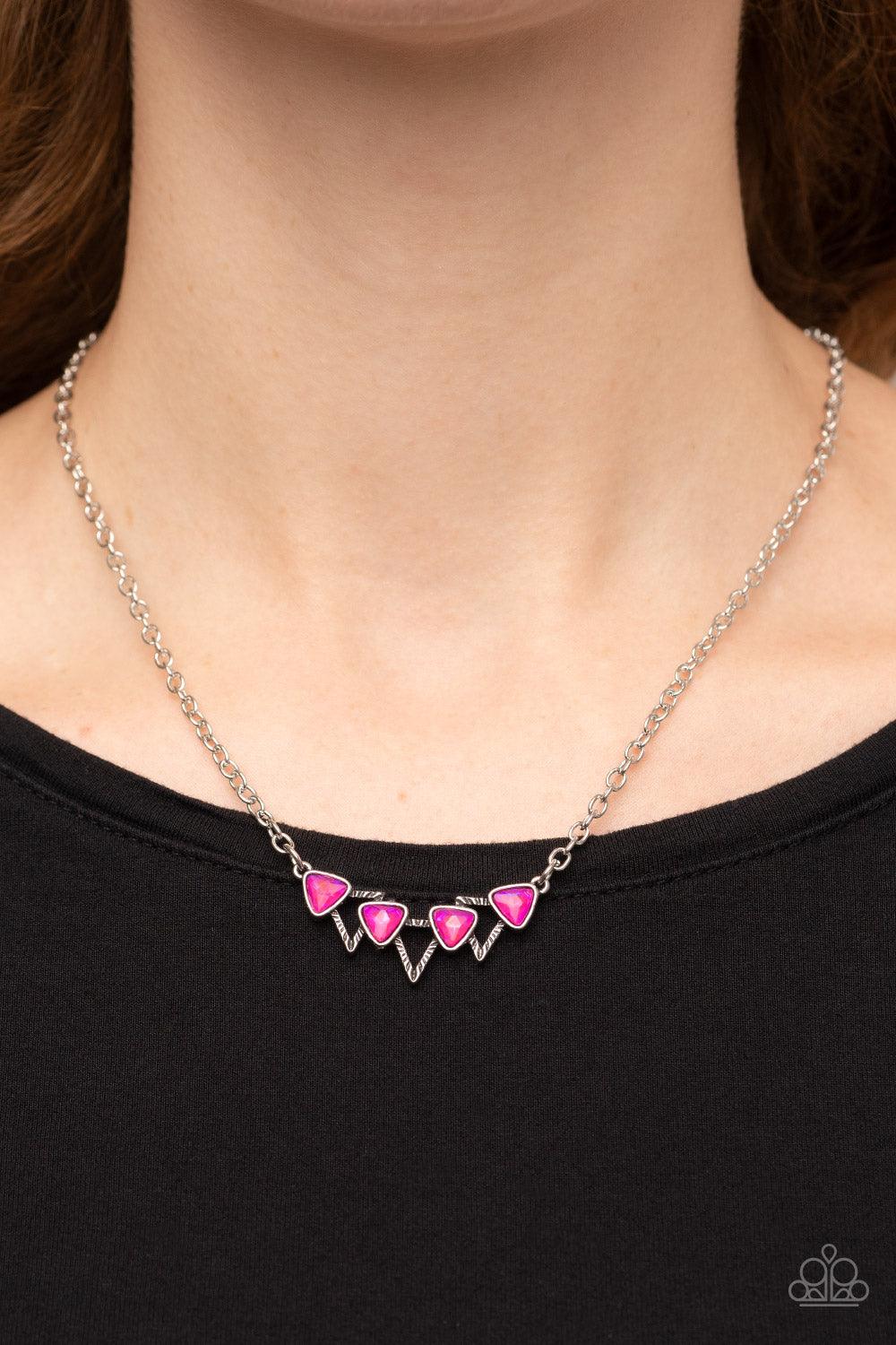Paparazzi Accessories Pyramid Prowl - Pink A staggered row of iridescent pink triangular gems stack across the front of a row of textured silver triangular frames, resulting in a stellar sparkle below the collar. Features an adjustable clasp closure. Sold