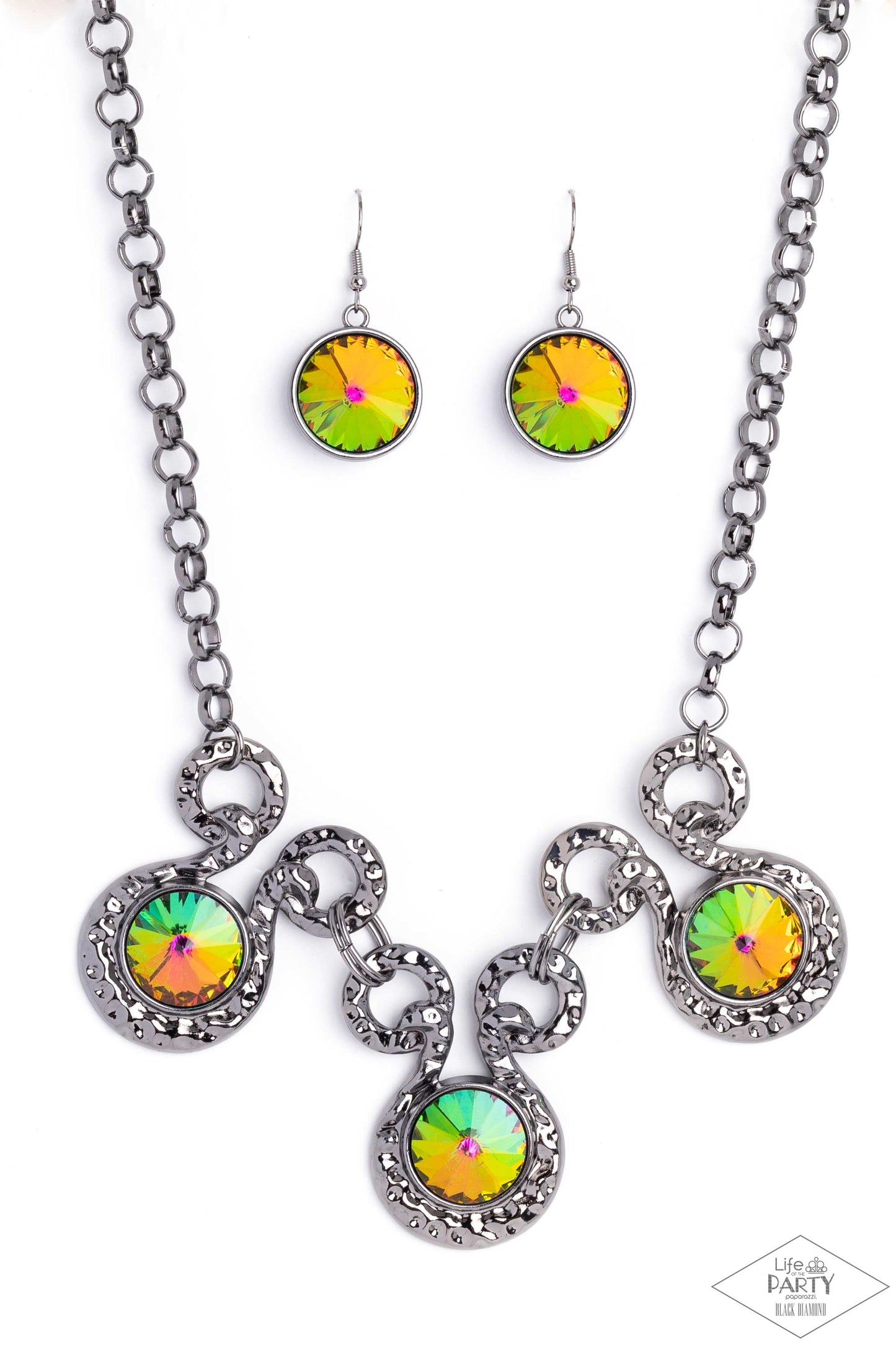 Paparazzi Accessories Hypnotized - Multi Three dramatically oversized oil spill rhinestones are nestled into three textured gunmetal fittings that are connected by oval gunmetal rings, creating a brilliant statement piece. Features an adjustable clasp clo
