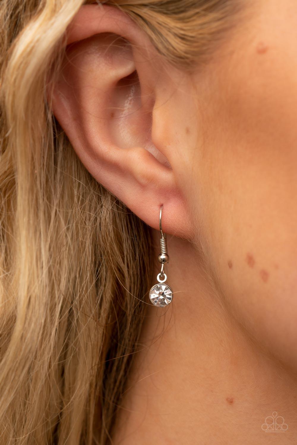 Paparazzi Accessories Finding My Forever - Pink Bordered in a ribbon of glassy white rhinestones, an oversized pink heart-shaped gem seemingly floats at the bottom of an extended silver chain. A shimmery silver chain tassel dances from the bottom of the s