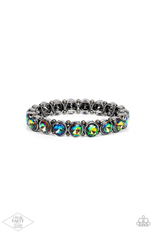 Paparazzi Accessories Sugar-Coated Sparkle - Multi 2 Infused with dainty gunmetal beads, glittery oil spill rhinestone encrusted frames are threaded along stretchy bands around the wrist for a glamorous look. Sold as one individual bracelet. Jewelry