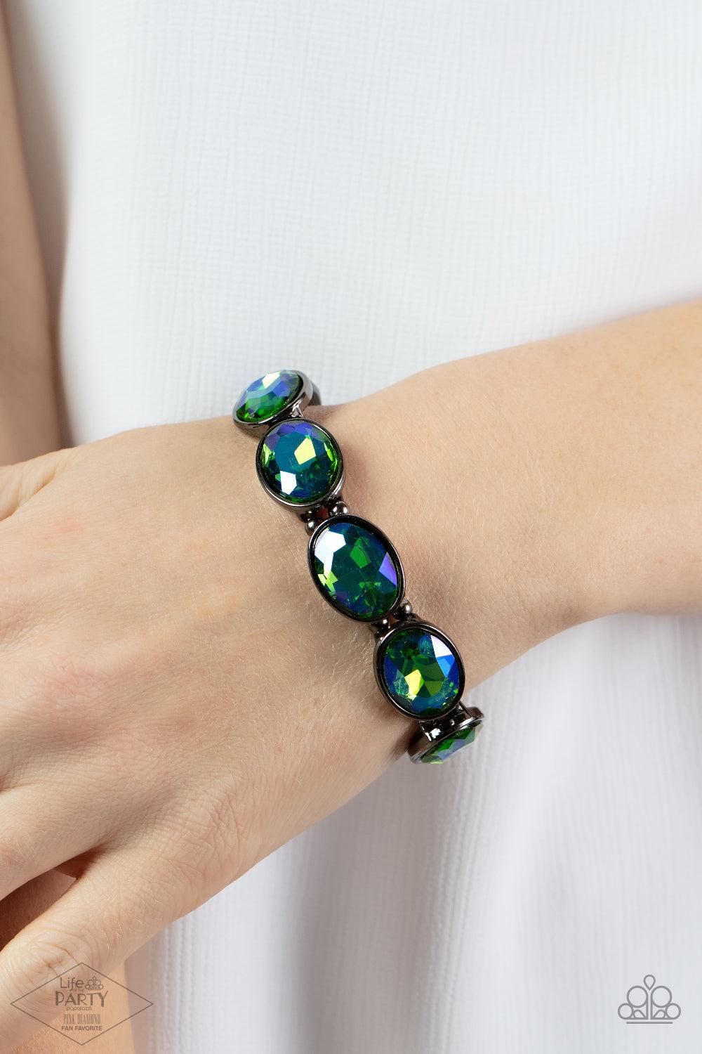 Paparazzi Accessories Diva In Disguise - Multi 3 Blue oil spill gems are pressed into sleek gunmetal frames. Infused with dainty gunmetal beads, the sparkly frames are threaded along stretchy bands for a glamorous look around the wrist. Sold as one indivi