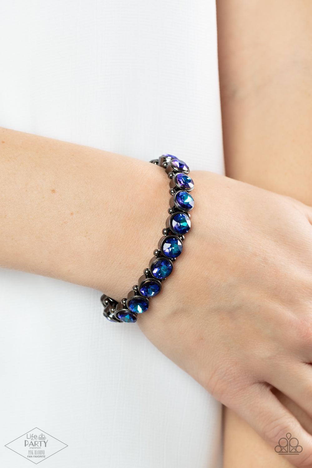 Paparazzi Accessories Sugar-Coated Sparkle - Multi 3 Infused with dainty gunmetal beads, iridescent blue rhinestone encrusted frames are threaded along stretchy bands around the wrist for a glamorous look. Sold as one individual bracelet. Jewelry