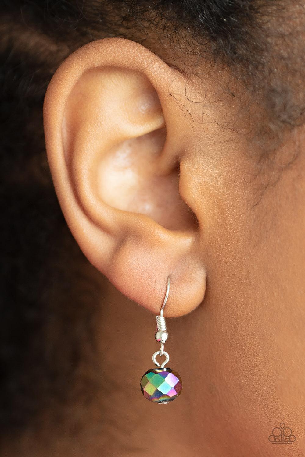 Paparazzi Accessories Cosmic Cadence - Multi Separated by silver discs and faceted silver accents, faceted oil spill crystal-like gems are threaded along an invisible wire below the collar for a stellar statement. Due to its prismatic palette, color may v