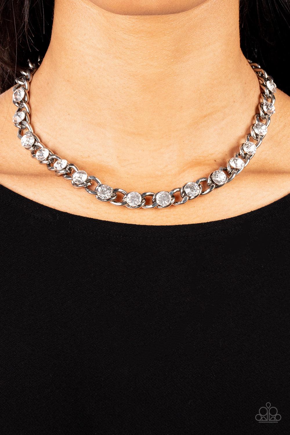 Paparazzi Accessories Major Moxie - White Oversized white rhinestones dot a row of oversized silver chain, resulting in a gritty glitz below the collar. Features an adjustable clasp closure. Sold as one individual necklace. Includes one pair of matching e