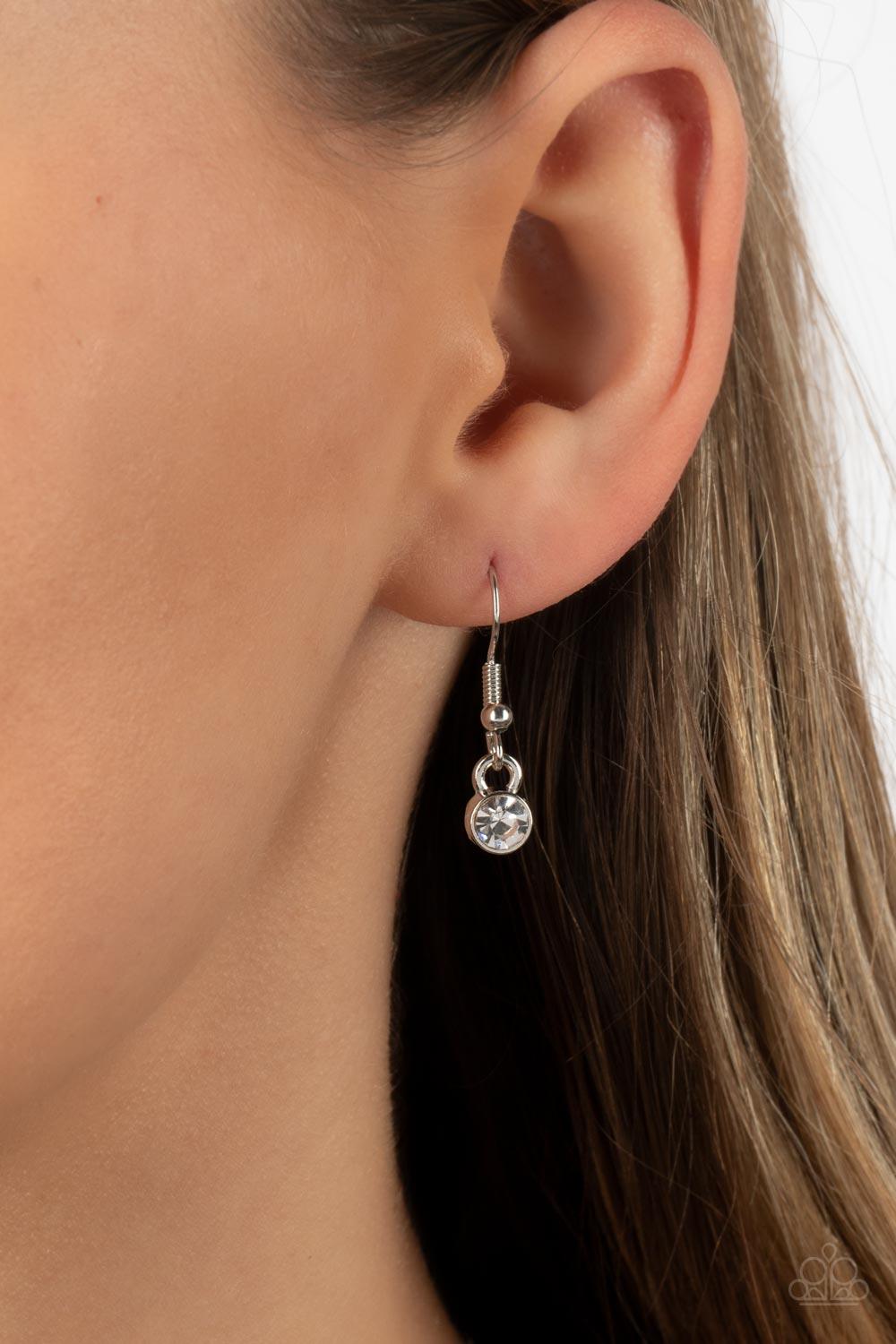 Paparazzi Accessories Unleash Your Sparkle - Yellow Dainty rows of glittery white rhinestones gently curve around the bottoms of oversized Daffodil oval gems. The sparkly frames delicately connect below the collar, creating a colorful centerpiece. Feature