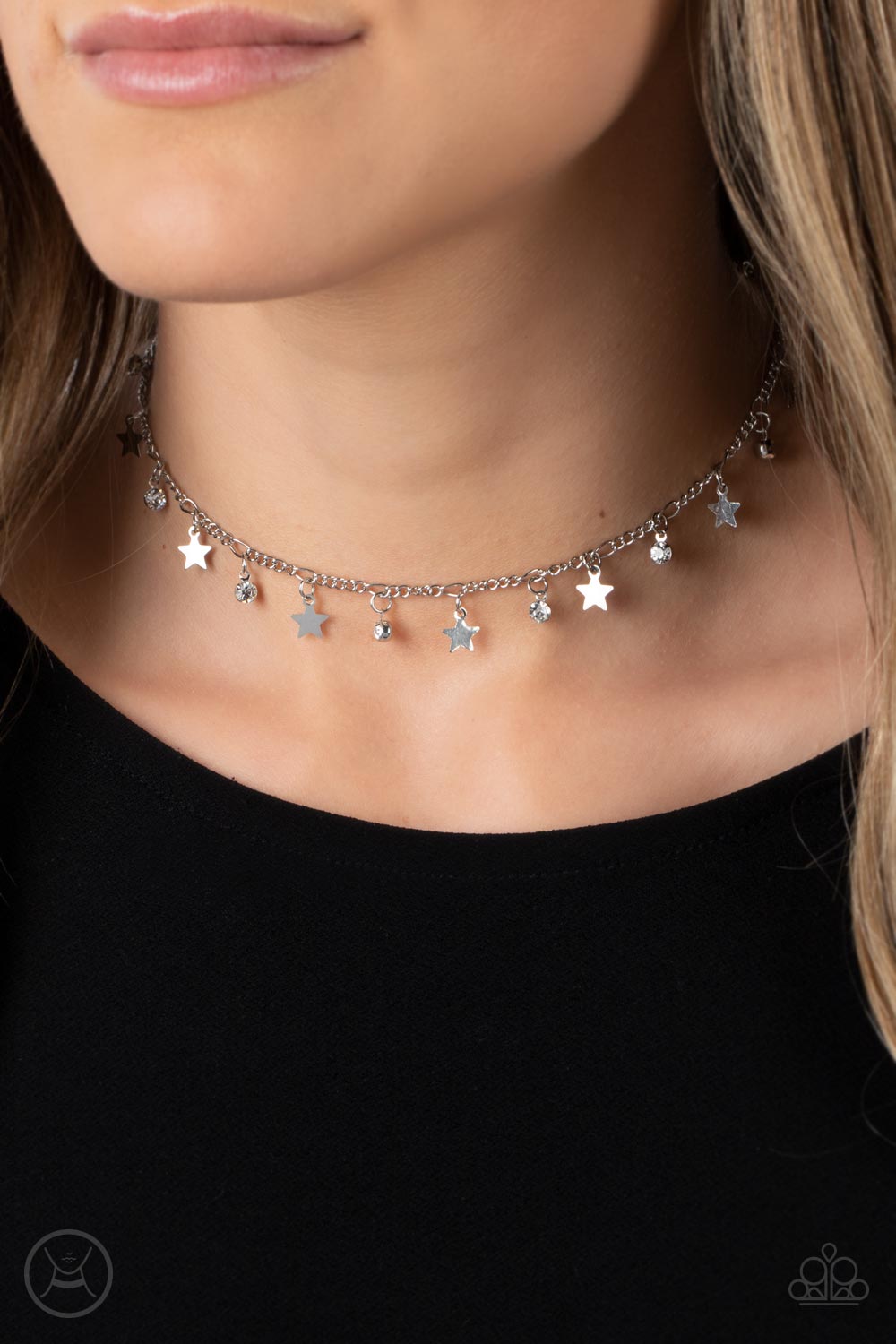 Paparazzi Accessories Little Lady Liberty - White Dainty white rhinestones and flat silver stars twinkle along a classic silver chain around the neck, resulting in a stellar fringe. Features an adjustable clasp closure. Sold as one individual choker neckl