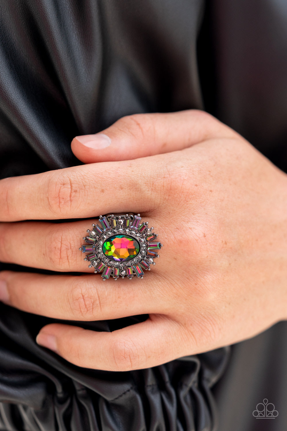 Paparazzi Accessories Astral Attitude - Multi A large oil spill rhinestone sparkles inside a ring of dainty hematite rhinestones. Emerald cut oil spill and hematite rhinestones fan out from the dazzling center, exploding into a stellar centerpiece atop th