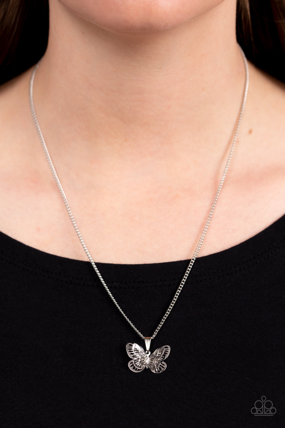 Paparazzi Accessories High-Flying Fashion - White A whimsical 3-D butterfly in a high sheen silver finish elegantly slides along a silver chain. An iridescent rhinestone is nestled at the center of the butterfly's wings, adding a hint of sparkle to the de