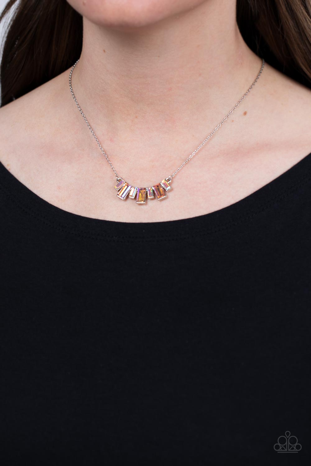 Paparazzi Accessories Hype Girl Glamour - Multi Emerald-cut gems in a peachy shade alternate with iridescent rhinestones in the same dramatic shape, falling in line to create a dainty pendant. The varying sizes of the gems create depth and dimension as th