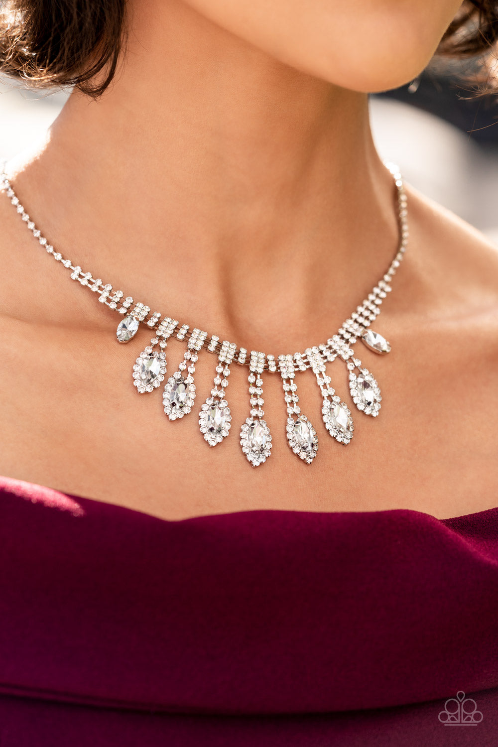 Paparazzi Accessories REIGNING Romance - White A classic silver chain leads down the neckline to a single strand of tiny rhinestones in dainty square fittings. A second row is added as the gems make their way to the centermost point of the design, where a