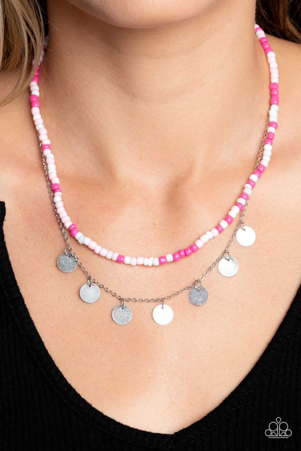 Paparazzi Accessories Comet Candy - Pink Pink Peacock, baby pink, and white seed beads are threaded along a wire, falling along the collar in a capricious pattern. A delicate silver chain, infused with twinkling silver discs, layers together with the colo