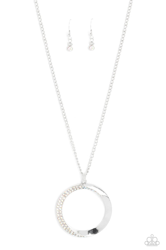 Paparazzi Accessories Encrusted Elegance - Multi An airy, oversized, warped, shiny silver hoop dangles down the chest from a classic silver chain. Two rows of dainty iridescent rhinestones encrust along the inner curve of the hoop for an understated, eleg