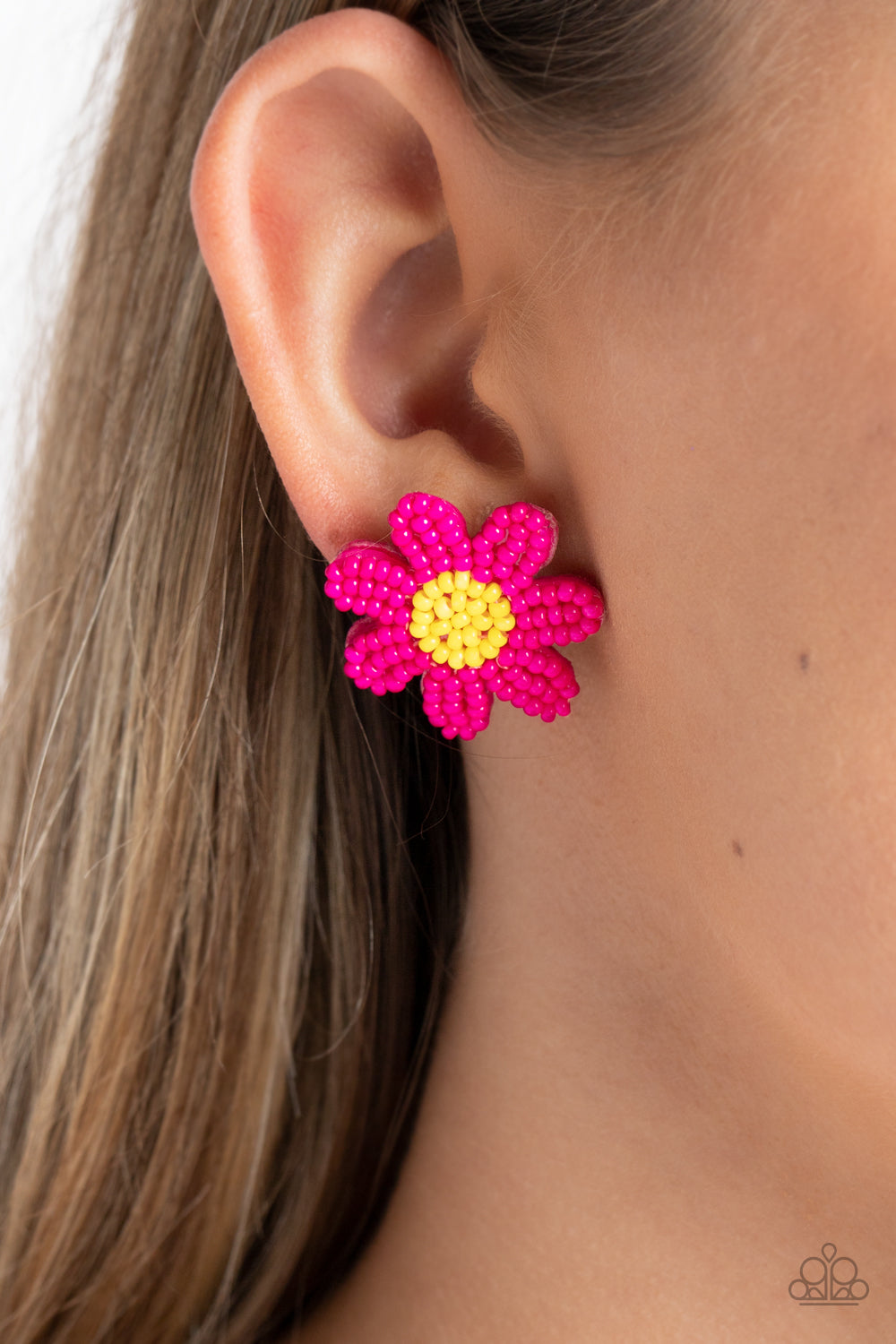 Paparazzi Accessories Sensational Seeds - Pink Layers of hot pink seed bead petals fan out from a yellow seed bead center, blooming into a textured floral centerpiece. Earring attaches to a standard post fitting. Sold as one pair of post earrings. Jewelry