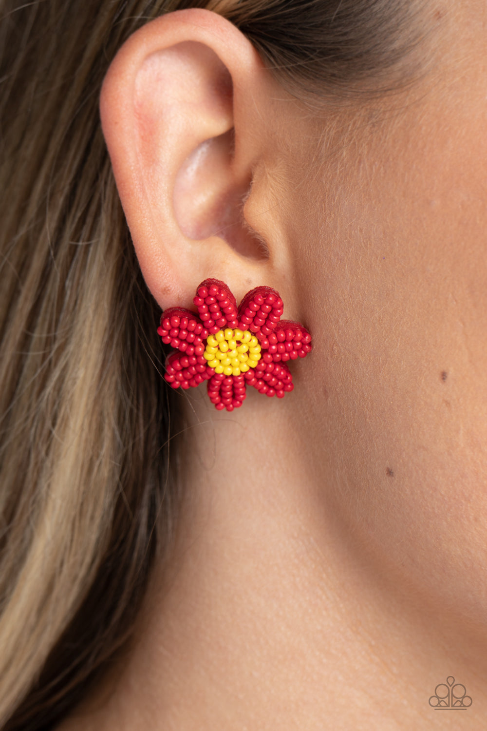 Paparazzi Accessories Sensational Seeds - Red Layers of red seed bead petals fan out from a yellow seed bead center, blooming into a textured floral centerpiece. Earring attaches to a standard post fitting. Sold as one pair of post earrings. Jewelry