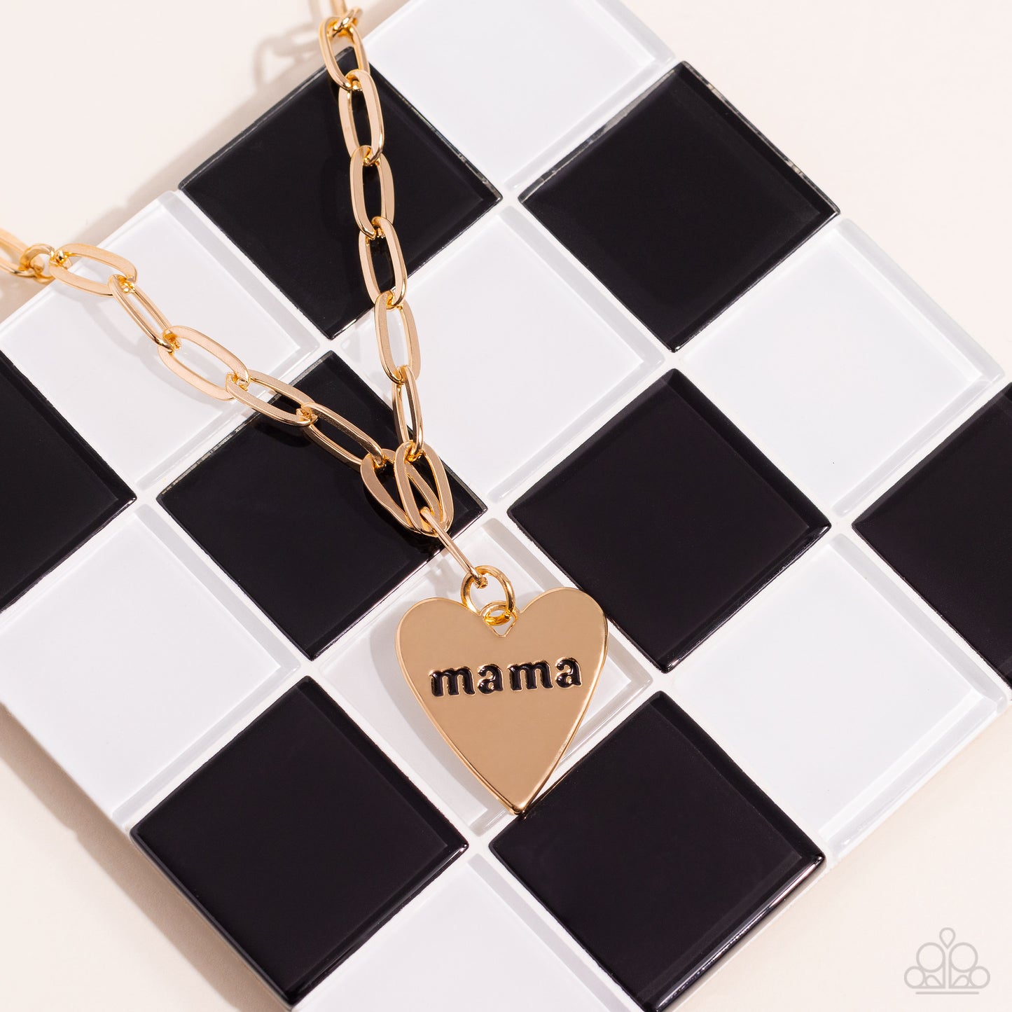 Paparazzi Accessories Mama Cant Buy You Love - Gold High-sheen gold ovals link down the chest drawing attention to the gold heart pendant at its bottom. Stamped with the word "mama" in its center, this monochromatic masterpiece gives off a simplistic, sen