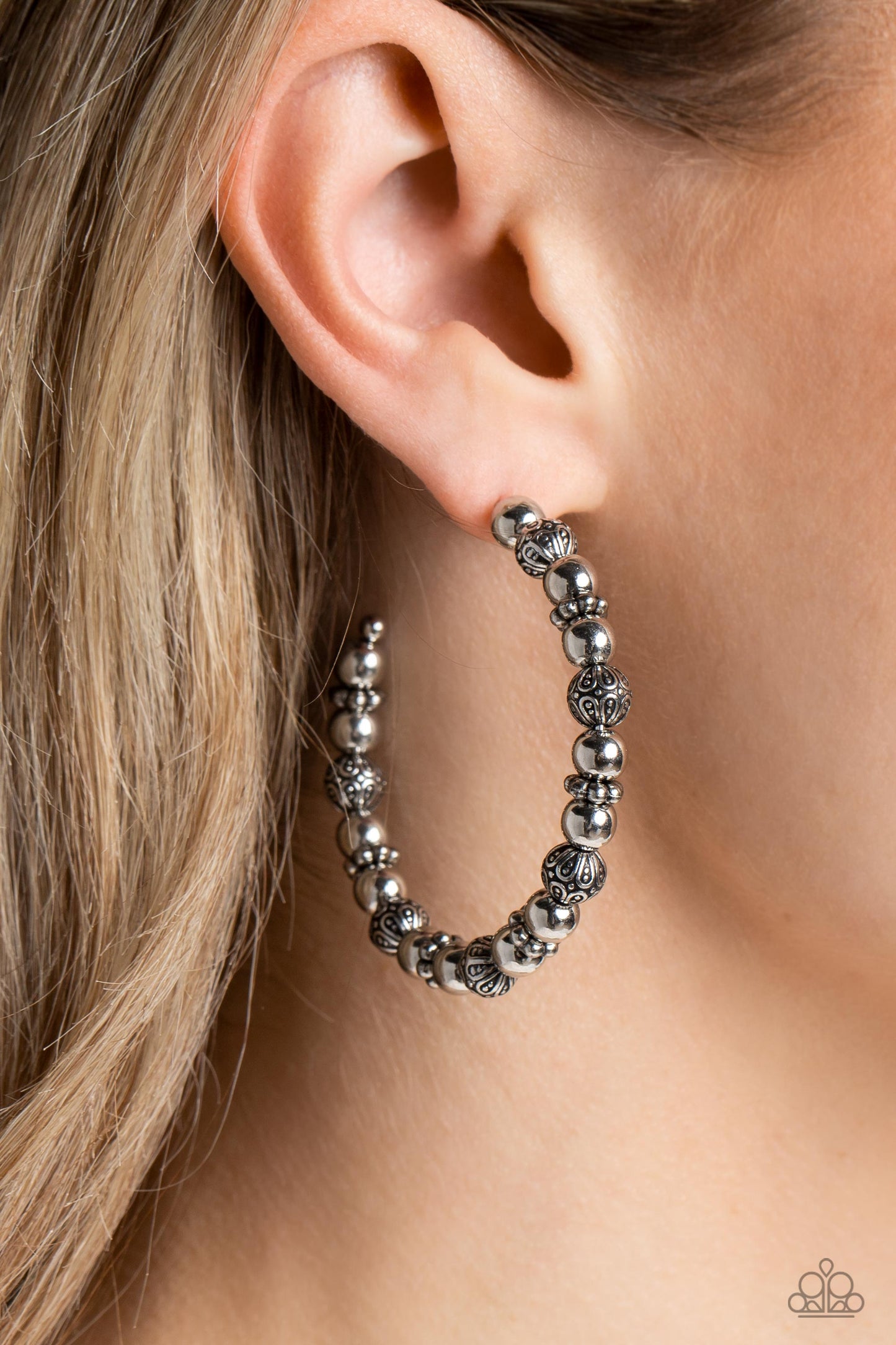 Paparazzi Accessories Rebuilt Ruins - Silver A collection of antiqued and decorative silver beads, silver wheel beads, and high-sheen silver beads are threaded along a thin curve around the ear for a trendy monochromatic look. Earring attaches to a standa