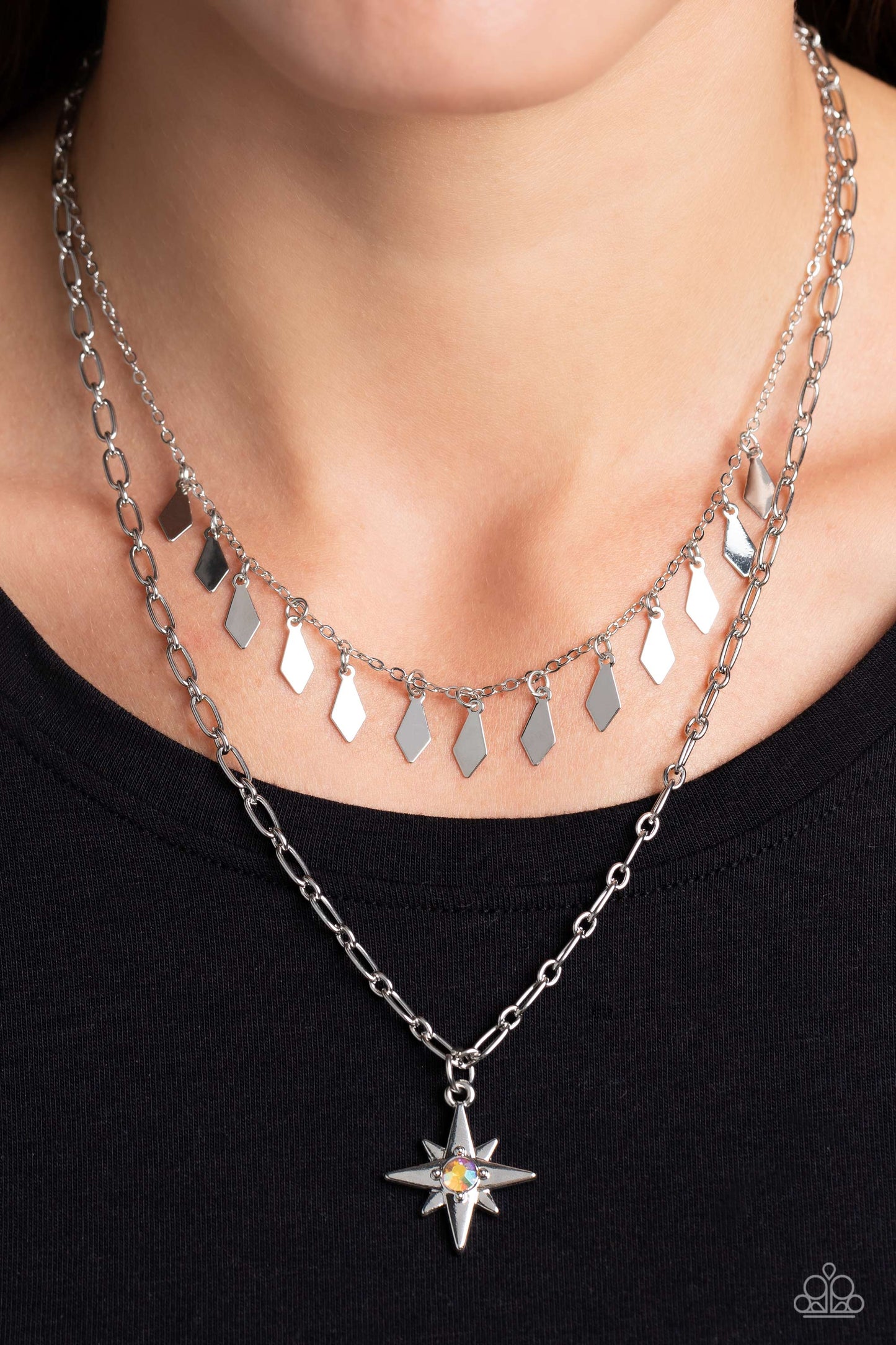 Paparazzi Accessories The Second Star To The LIGHT - Orange A three-dimensional silver star, dotted with a single orange-iridescent rhinestone glides on a paperclip chain down the neckline for an out of-this-world vibe. Flat and flared silver frames dance