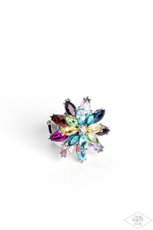 Paparazzi Accessories Am I GLEAMing? - Multi Glittery colorful rhinestones in the shape of petals stack into a glamorous floral frame atop the finger, creating a blinding centerpiece. Features a stretchy band for a flexible fit. Due to its prismatic palet