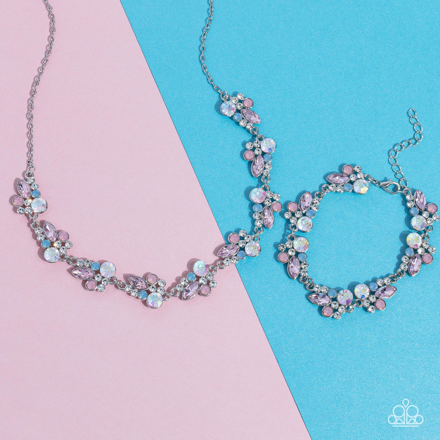 Paparazzi Accessories Swimming in Sparkles - Multi An eclectic collection of white, blue, iridescent and light peach round rhinestones in varying sizes and marquise-cut gems in a light pink shade cluster around the collar in high-sheen silver frames. Patt
