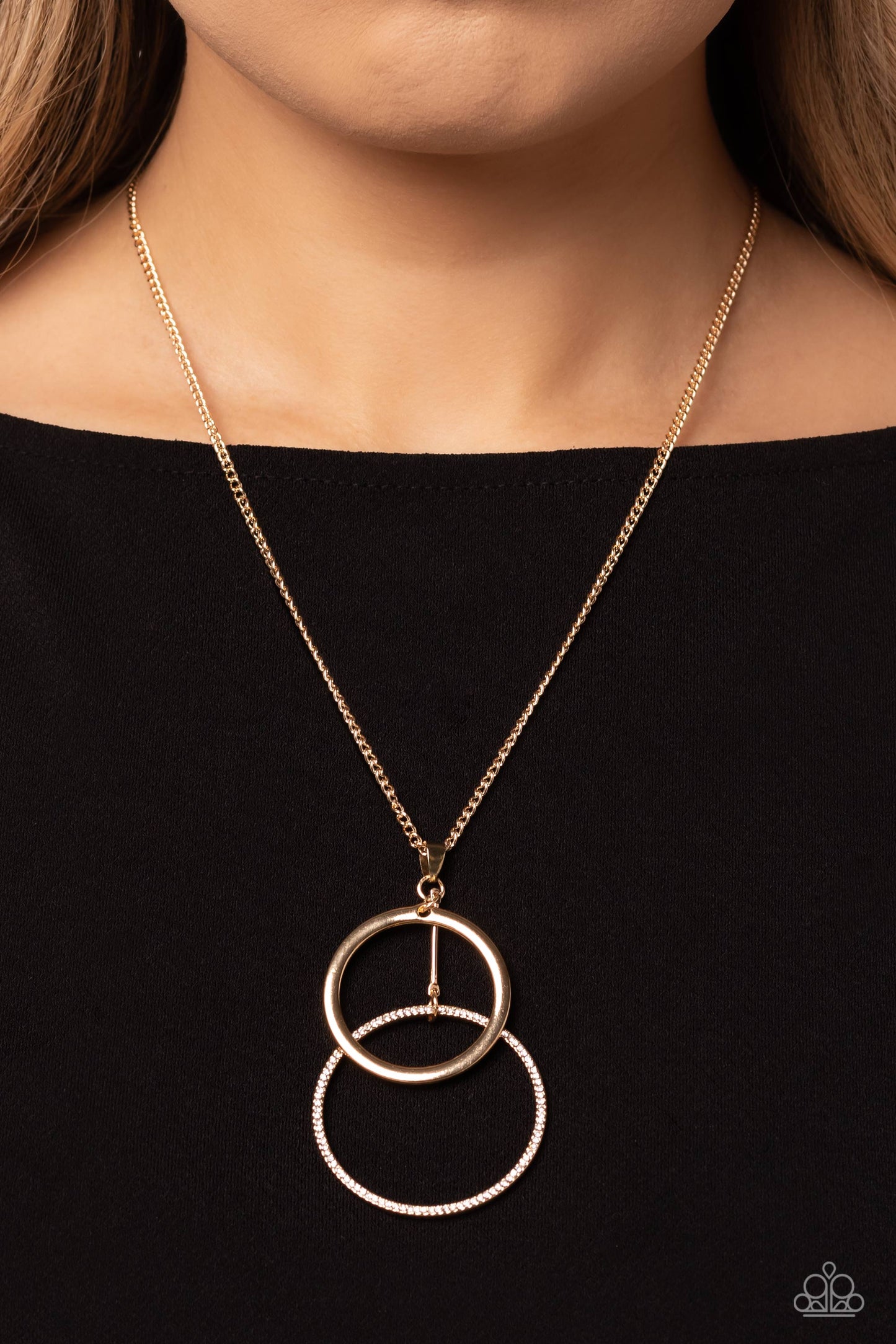 Paparazzi Accessories Wishing Well Whimsy - Gold Falling from a classic gold chain, a high-sheen gold ring is overlapped by a bigger gold ring embossed with dainty white rhinestones for a simple, scintillating statement. Features an adjustable clasp closu