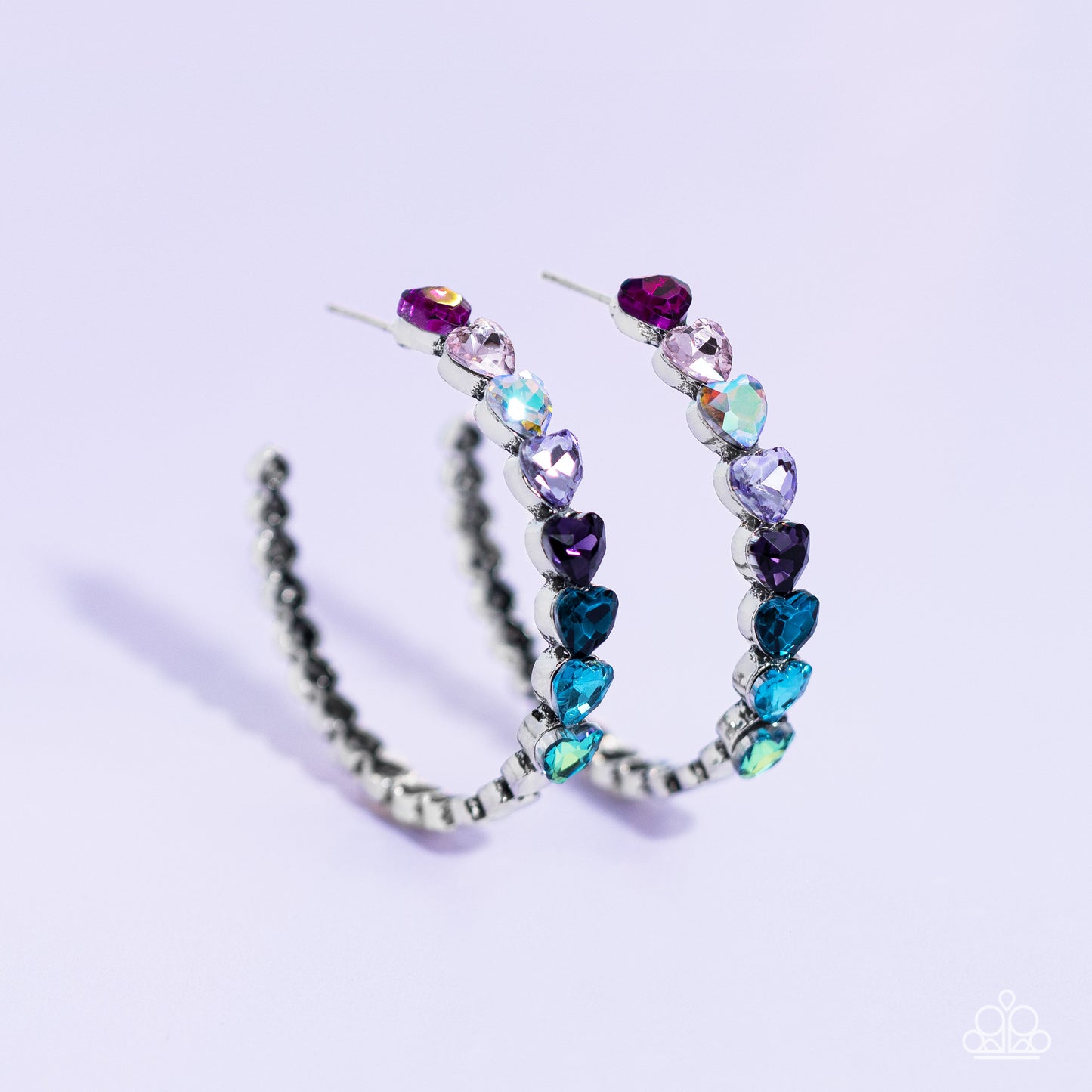 Paparazzi Accessories Hypnotic Heart Attack - Multi Featuring a scalloped heart frame, glittery heart rhinestones in shades of pink, iridescence, purple, blue, and a refracted green shimmer slowly decrease in size as they curve down the ear to meet dainty