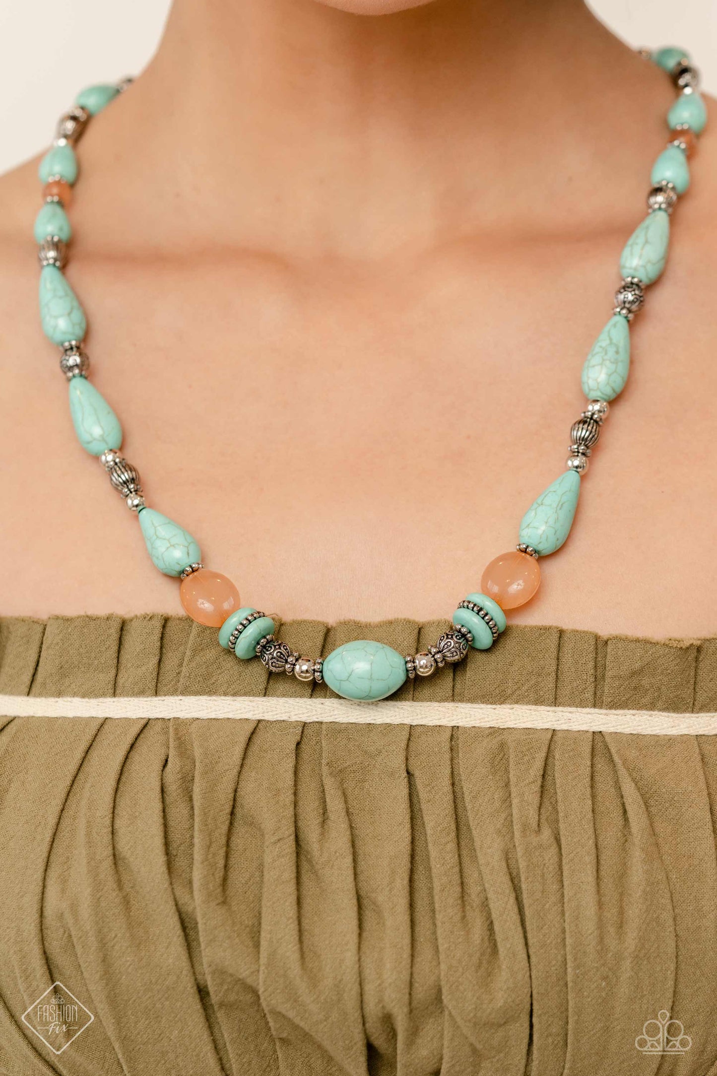 Paparazzi Accessories Nile River Redux - Blue Infused along an invisible wire, muted turquoise stones in various sizes, striped silver beads, textured silver beads, floral silver wheel beads, silver accents, and milky coral beads in varying sizes combine