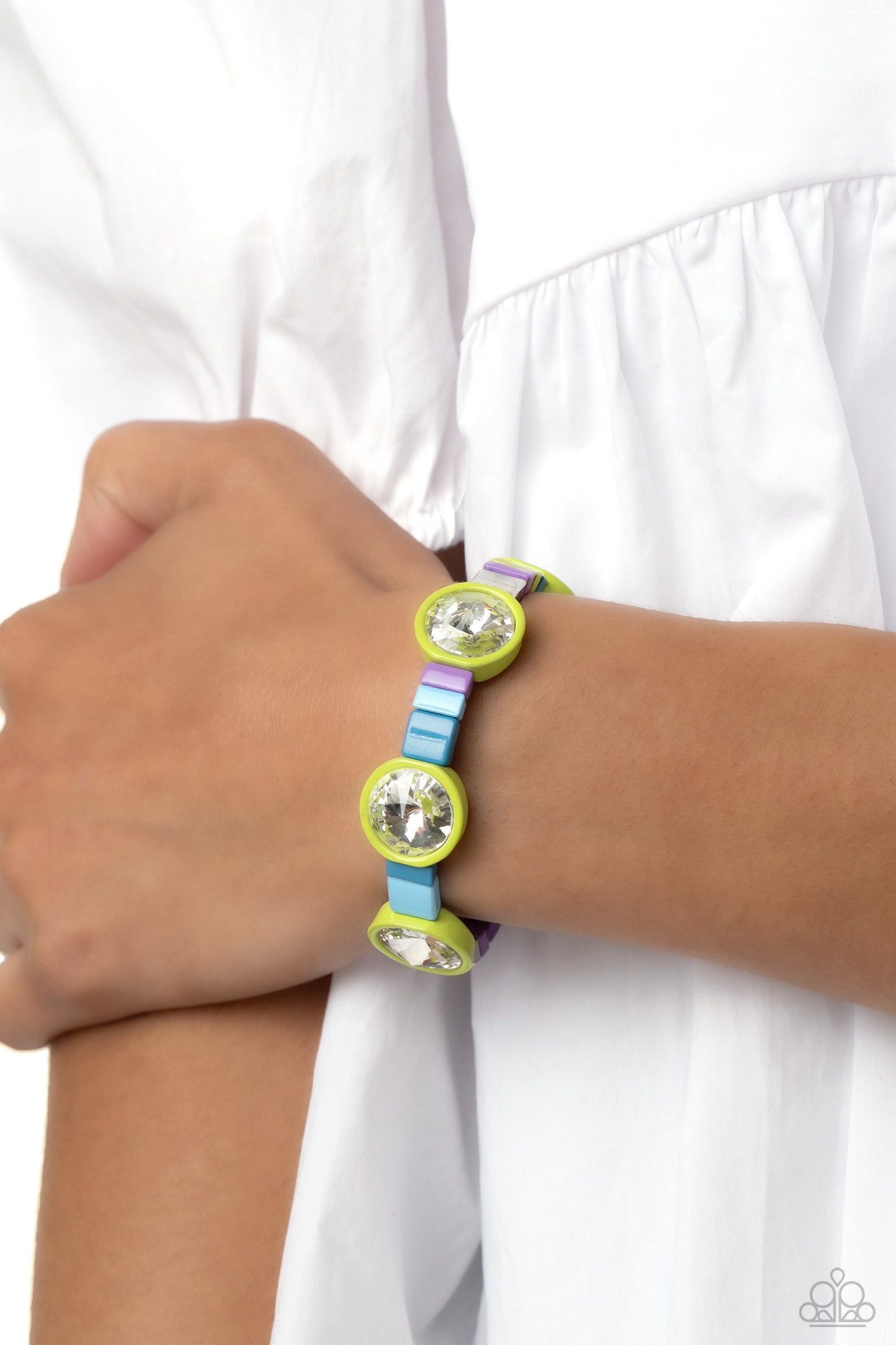 Paparazzi Accessories Multicolored Madness - Green Strung along elastic stretchy bands, a bodacious collection of silver accents, and varying metallic accents dipped in colorful shades encircle the wrist. Sporadically infused between the colorful display,
